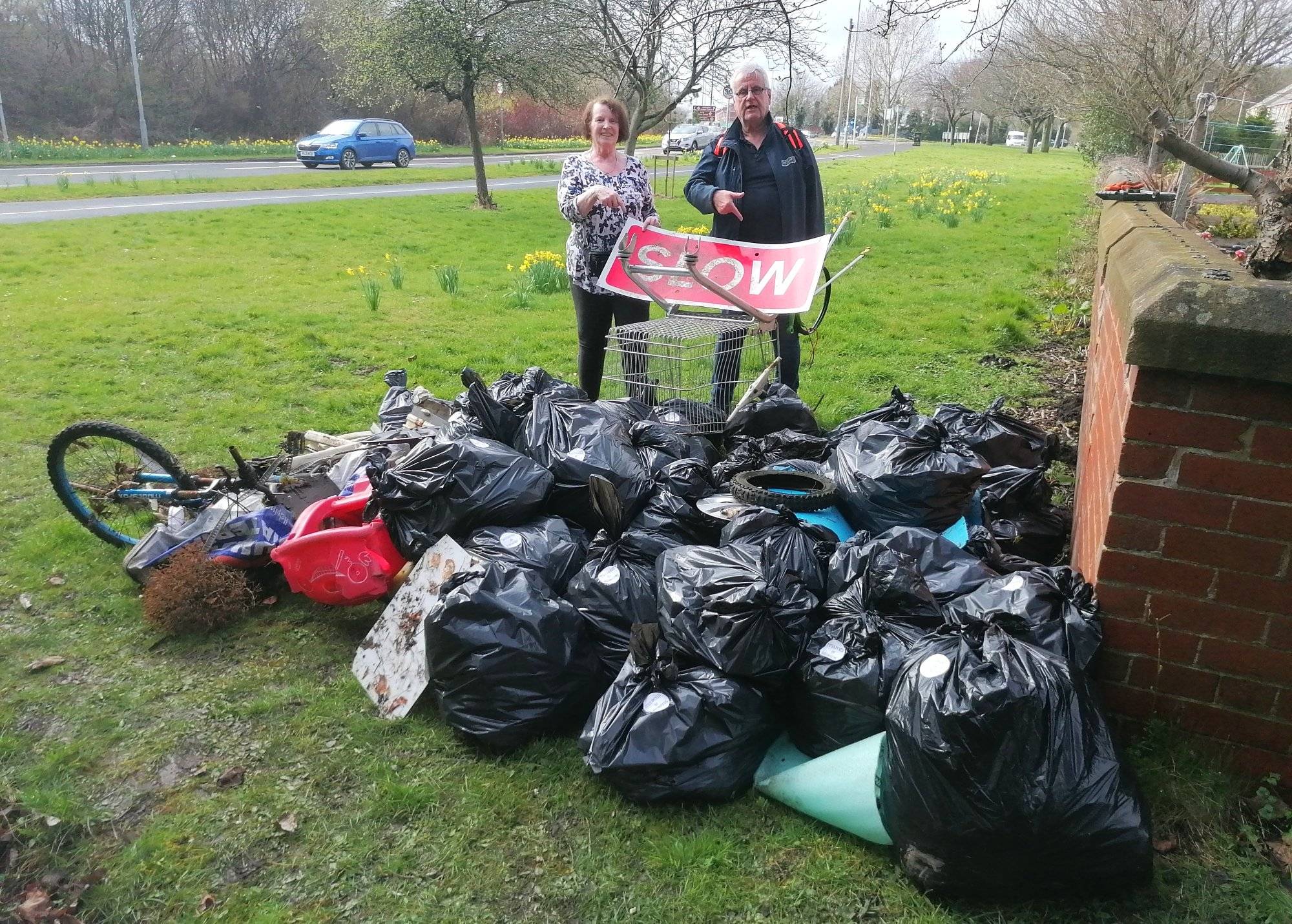 Cllr Thompson and Community litter picker with bags of rubbish